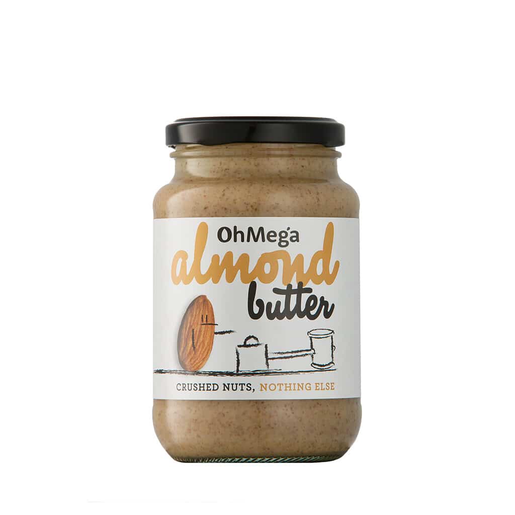 OhMega Almond Butter in a glass jar with a white label, showcasing the smooth, creamy almond butter, perfect for spreading and adding to recipes.
