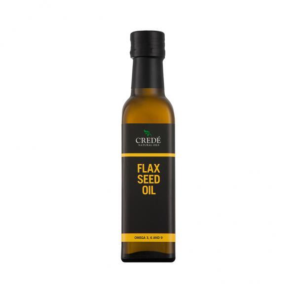 Crede Flaxseed Oil in a dark amber bottle with a pour spout, showcasing the golden oil, perfect for enhancing health and wellness.